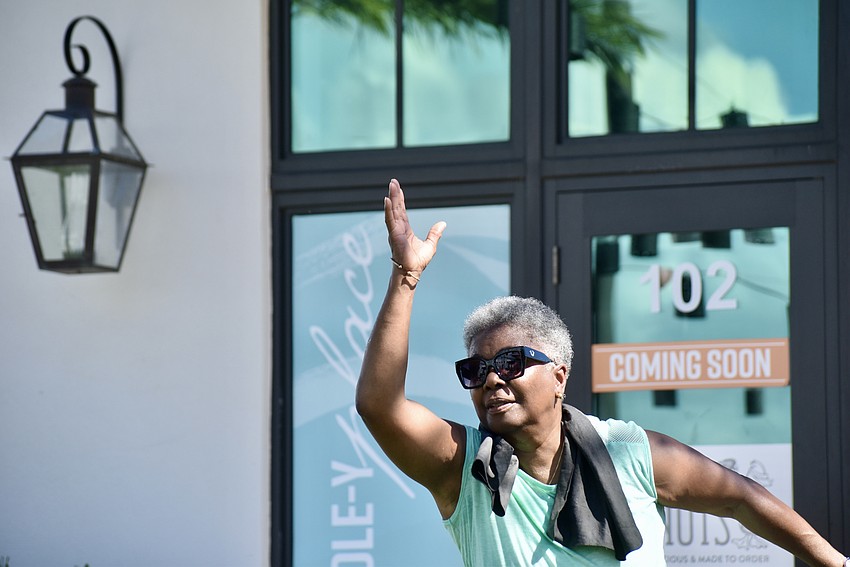 Barbara Bishop-Reid tosses a beanbag like a pro.