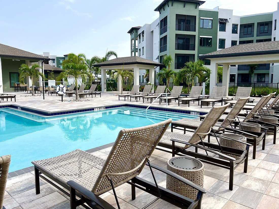 A pool with cabanas is part of the surroundings at Gateway Commons, a new apartment community in Manatee County.