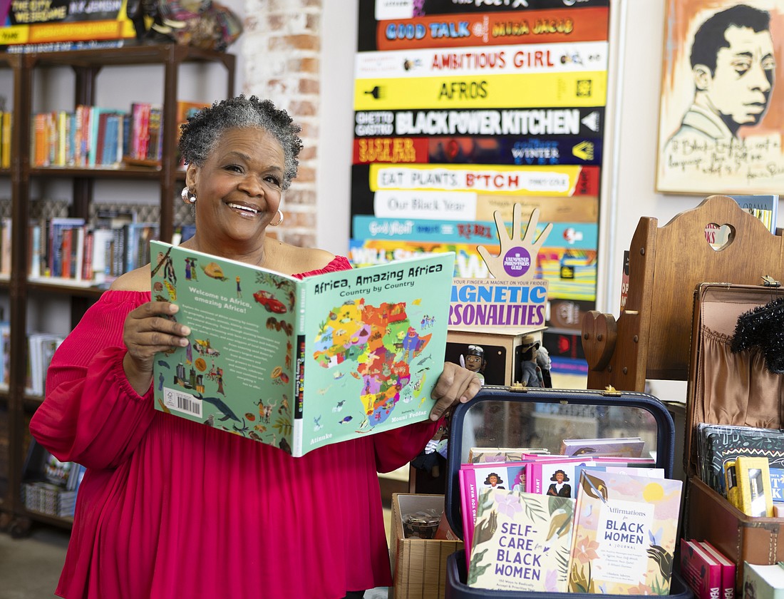 Gwen Henderson, owner of Black English Bookstore in Tampa, poses in her shop.