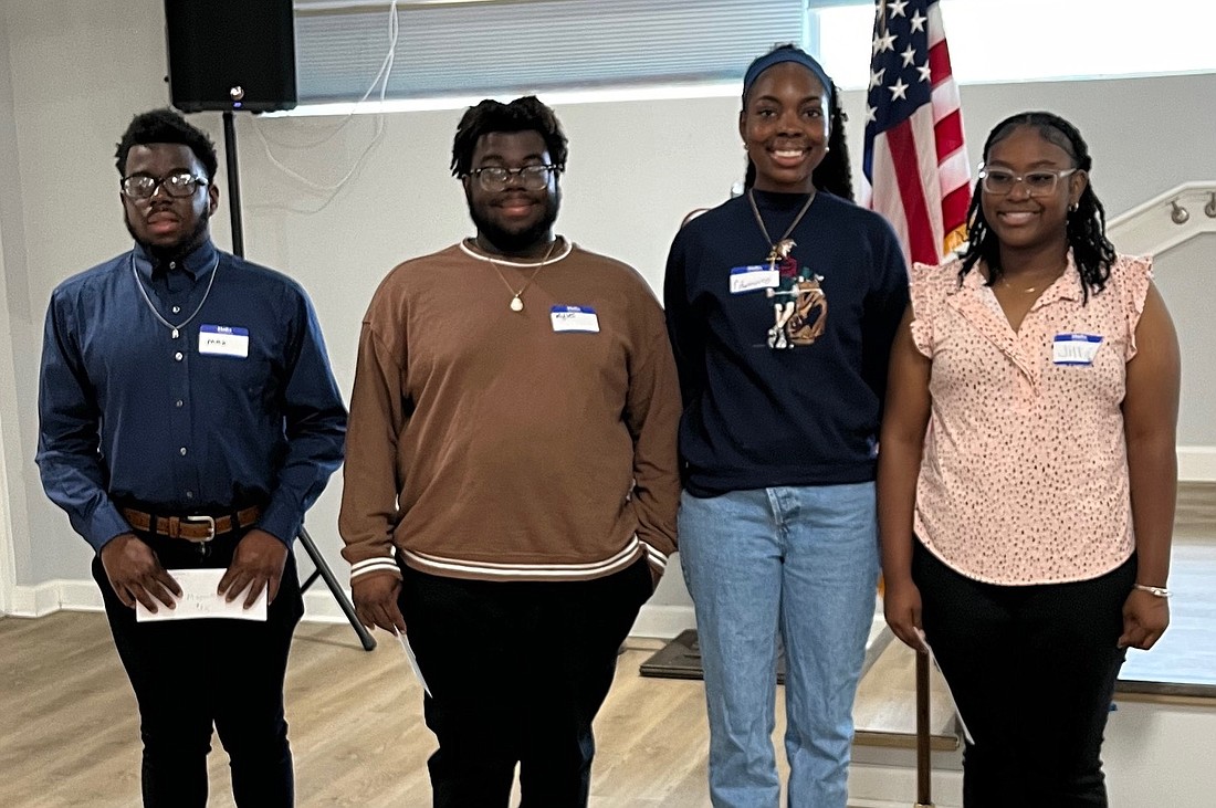 African American Cultural Society scholarship recipients Maxwell Lee, Myles Lee, Edwina Mezo Brown and Jill Prime