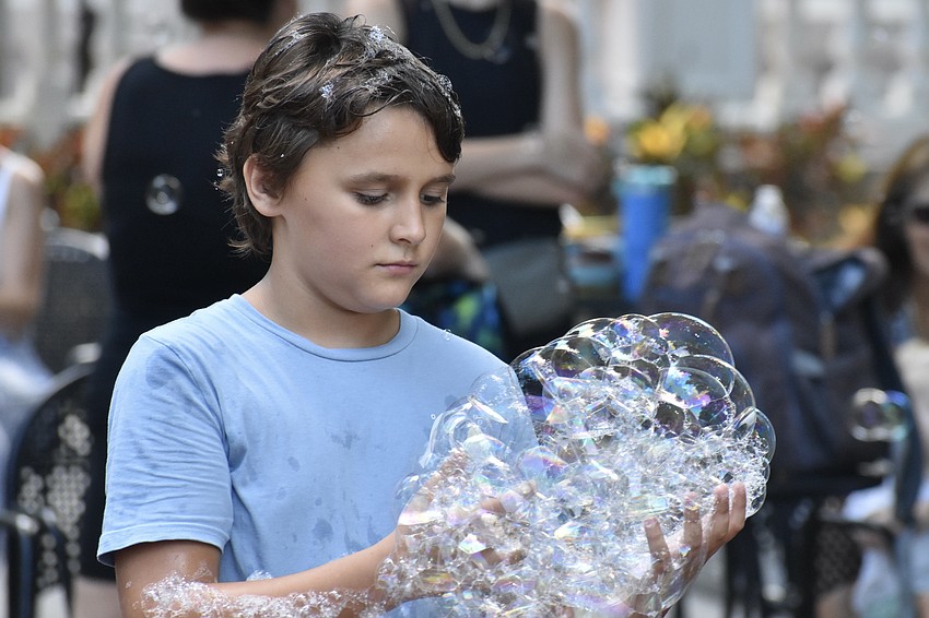 Andrew Shram, 9, finds something to take away from the event.