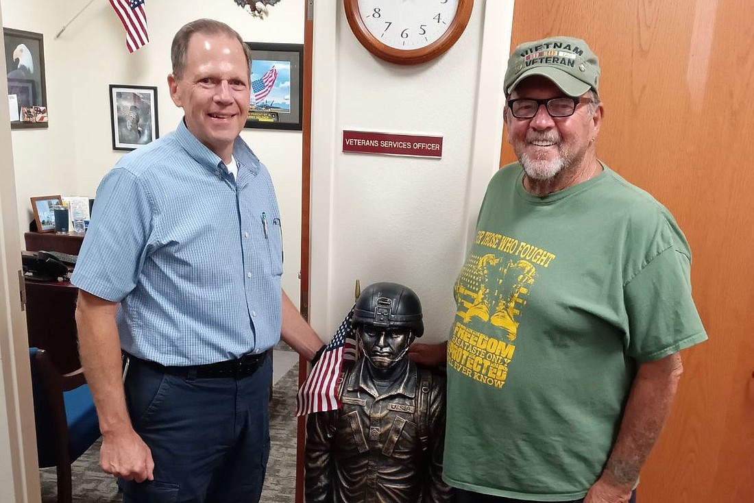 Robert Burbridge (right) with Flagler County Veteran Services Coordinator David Lydon.