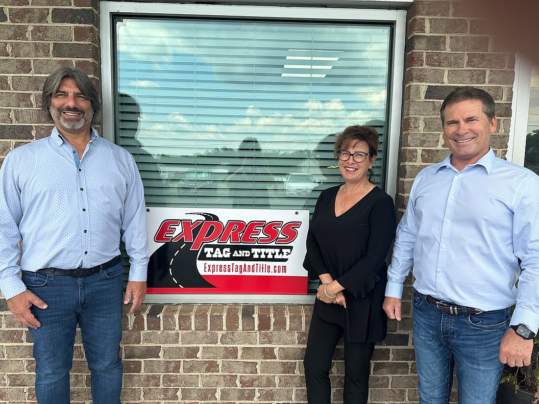 From left to right,  Tag Agency Professionals Inc. COO Rick Becker,  Tag Agency Professionals-Express Tag and Title President Valerie Sell and  Tag Agency Professionals CEO Ron Moore. Tag Agency Professionals recently acquired Virginia-based Express Tag and Title.