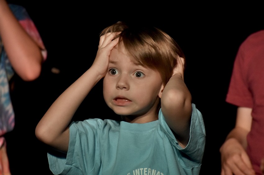Oliver Stillwell, 7, practices an opening recitation.