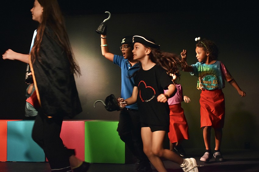 Marleah Galli, 11, Giovanni Theiner, 9, Ember Bly, 5, Brooklyn Koenreich, 5, and Avenn Zarchev-Miller, 7, run in circles, in a chase involving space pirates.