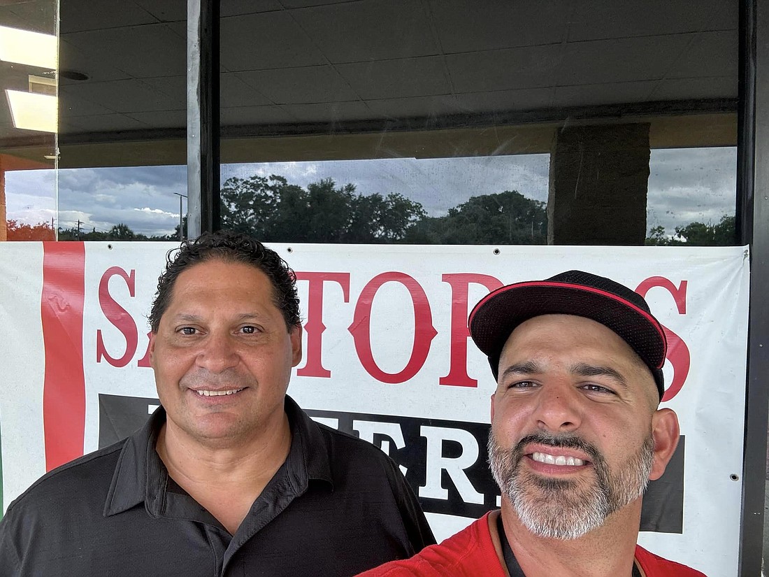 Willie Laboy, left, with Anthony Santora of Santora's Pizzeria in Ocoee.