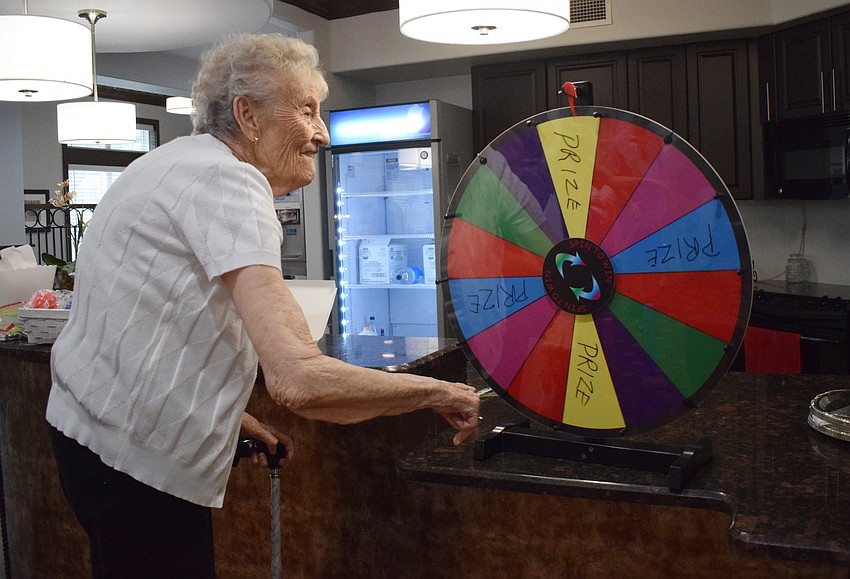 Joan Endler spins the wheel in hopes of winning a prize.