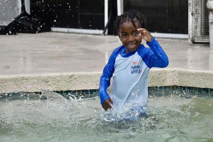 Sarasota resident Jamir Brown cools off in the pool.