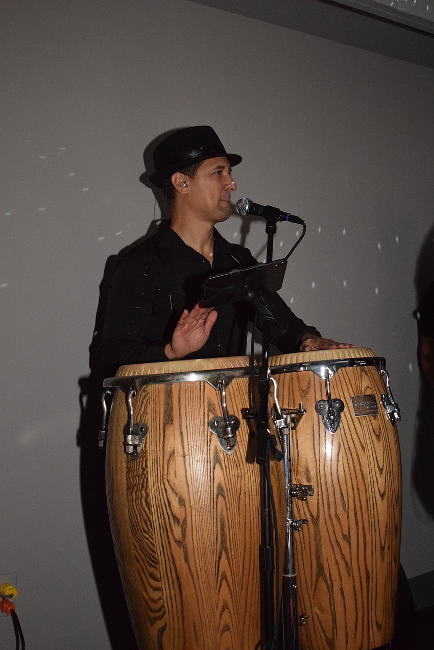 Luis Inciarte plays the conga drums at 15 South By Napule.