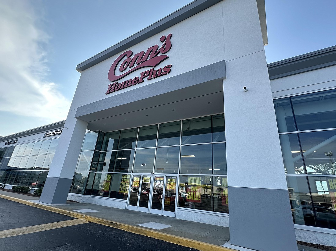 Store closing signs cover the windows at Conn’s HomePlus at 9278 Arlington Expressway in the Regency Court Shopping Center.