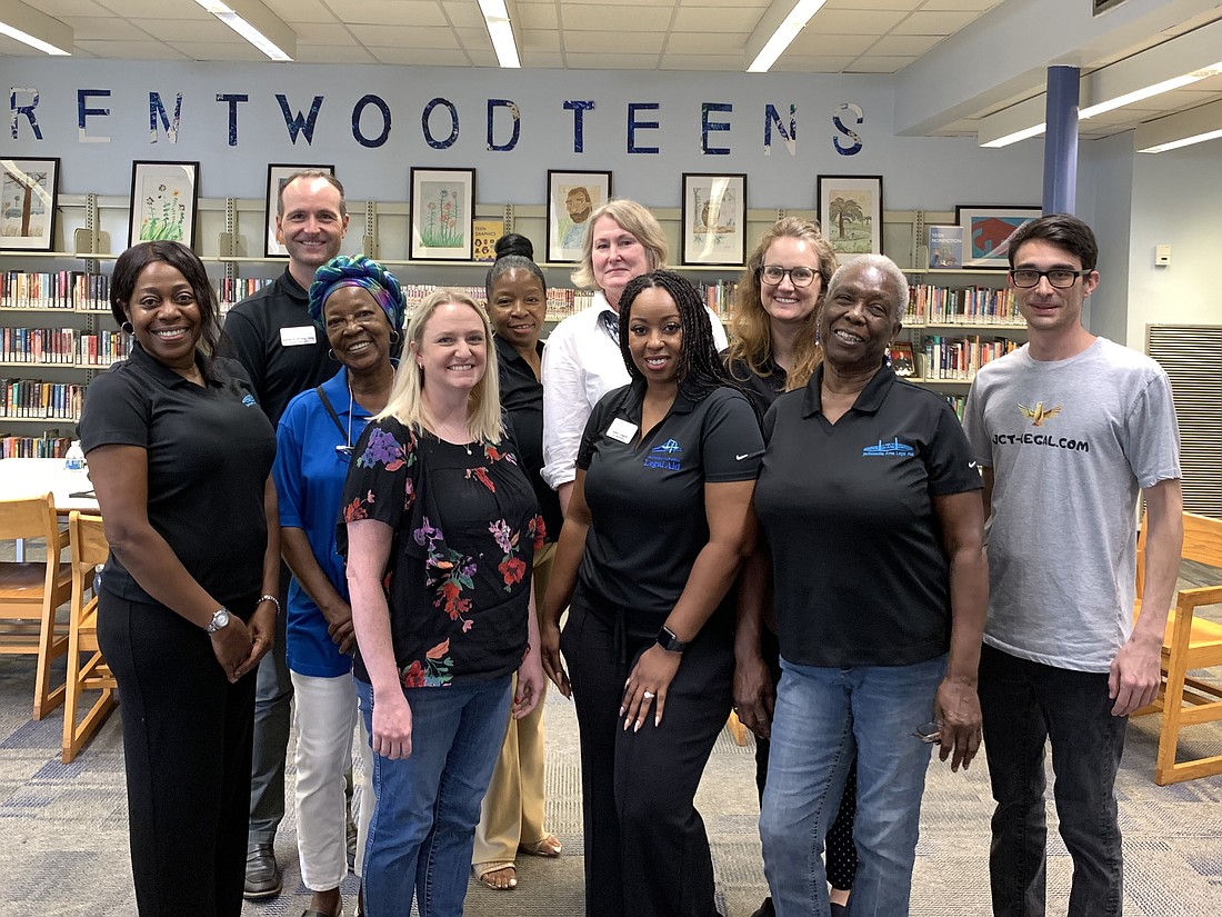 From left, Fabian Jackson, Aaron Irving, Patenia Bogan, Jineane McMinn, Patricia Balkcom, Pam Lynde, Ashley Goggins, Jacqi Nguyen, Phyllis Maxwell and Joshua Terembes volunteered at a Jacksonville Area Legal Aid pro bono clinic June 22 at the Brentwood Branch Public Library.