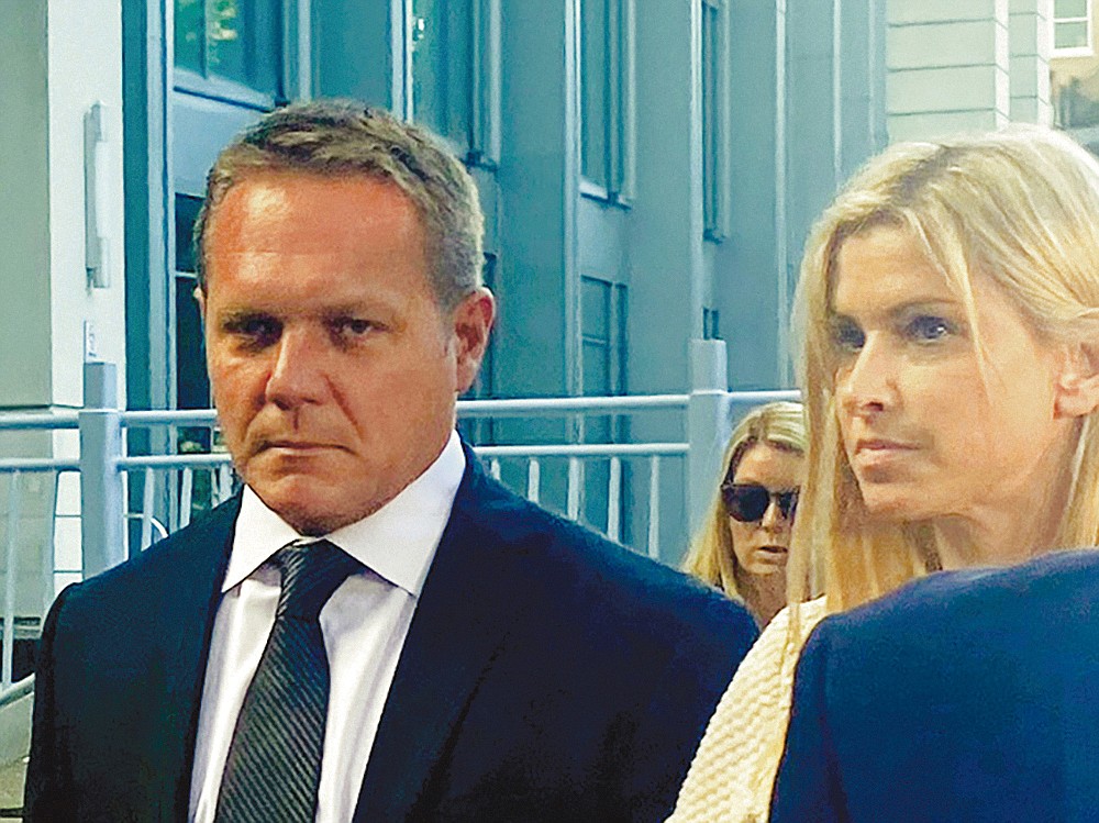 Convicted former JEA CEO Aaron Zahn leaves the Bryan Simpson U.S. Courthouse with his wife, Mary Branan Ennis Zahn, after being sentenced July 30 to four years in prison for wire fraud and conspiracy in the abandoned sale of the city-owned utility.