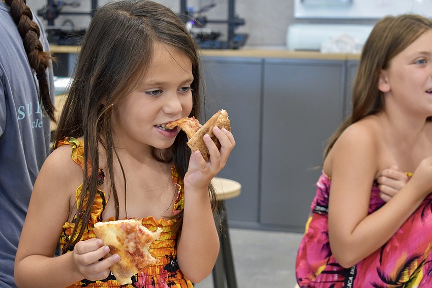 Lakewood Ranch resident Olivia Weldon, 6, is torn between pizzas No. 3 (Fresh Market) and No. 4 (Michelangelo's).
