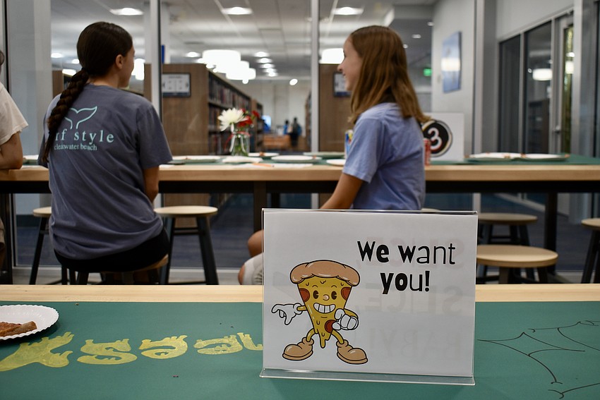 Library patrons are treated to pizza on July 31 at the Lakewood Ranch Library.