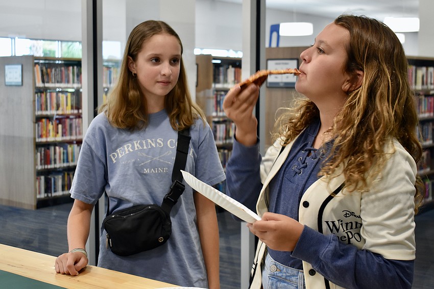 Lakewood Ranch resident Mairead Reardon, 12, waits to see which pizza Ava Hempfling, 11, will choose.