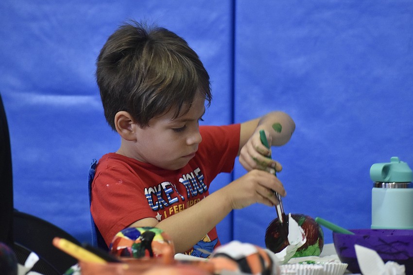 Bruce Hernandez, 5, works on an art project.