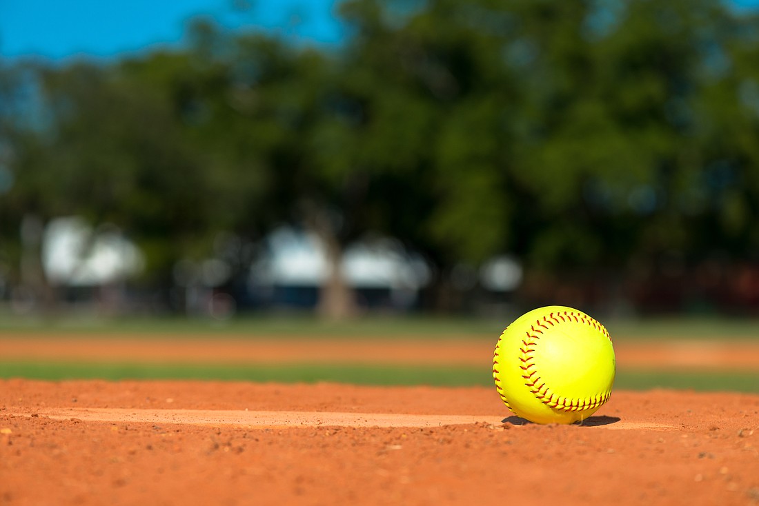 Yellow softball on pitchers mound