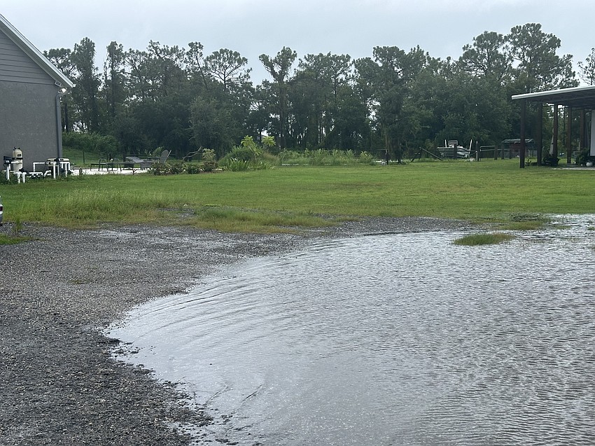 Water from the pond breaches the property of Myakka City's Carol Ricks.