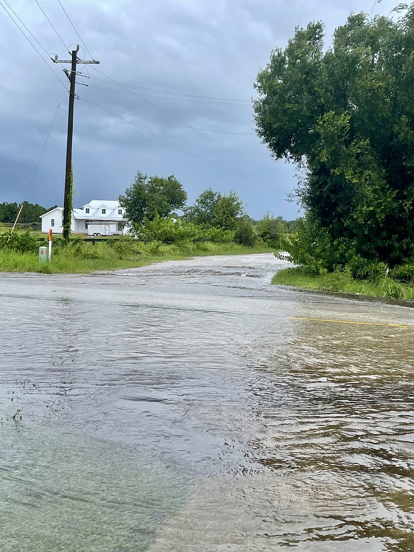 County Road 675 is completely under water at the intersection of 61st Avenue East.