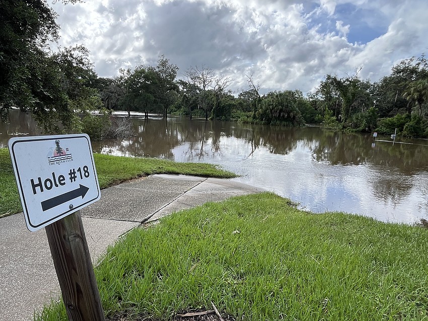 Hurricane Debby makes it difficult to play golf at The River Club as waters take over Hole 18.