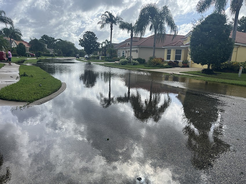 The floods on Royal Lytham Avenue keep residents from leaving their neighborhood on Tuesday morning,