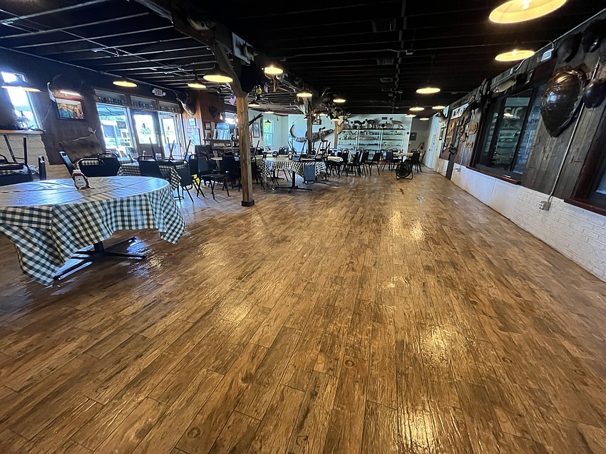 Linger Lodge Restaurant's workers spent Tuesday morning clearing away 3 inches of water that flowed into the restaurant.