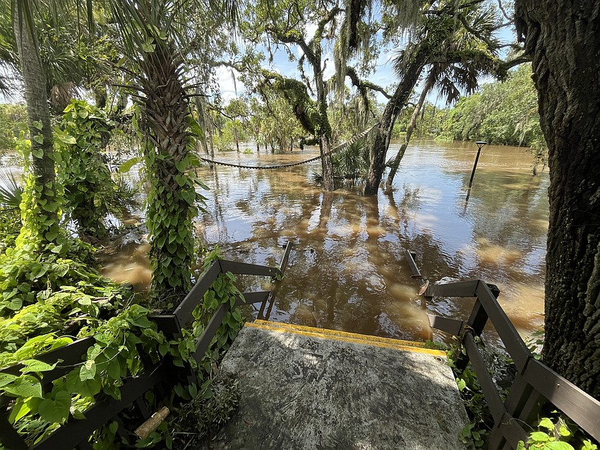 The water recedes into the Braden River after pushing its way through the Linger Lodge Restaurant.