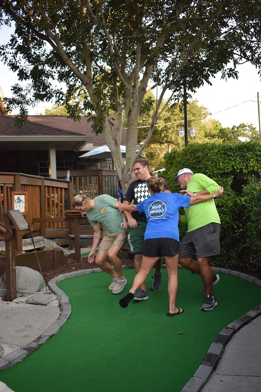 Acting like a bowling ball, Lakewood Ranch's Marcia Bailey takes down Palmetto's Collin Thole, Bradenton's Jon Koll and GreyHawk Landing's Francis Lopez.