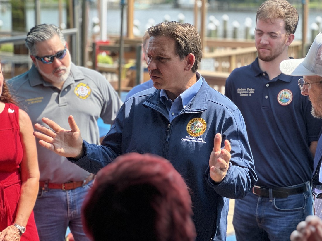 Gov. Ron DeSantis talks with Sarasota business owners affected by Tropical Storm Debby at the Philippi Creek Oyster Bar on Wednesday, Aug. 7.