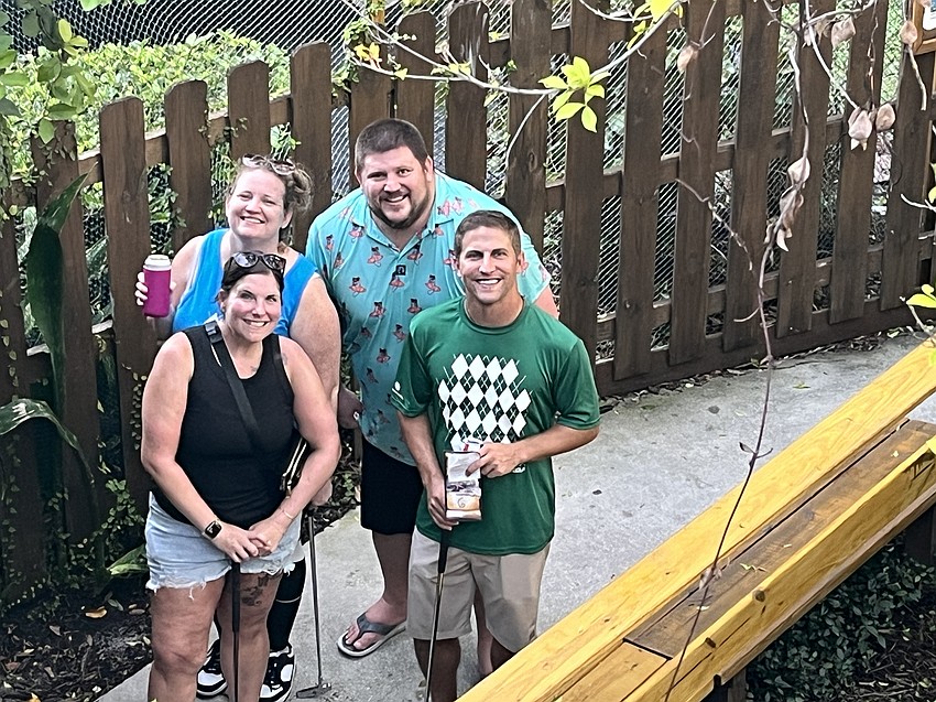 Rose Sumrall, Elizabeth Steinke, Chris McComas and Jacob Barker are one of the last groups from MVP Sports and Social to start the course, but that doesn't stop them from having a good time.