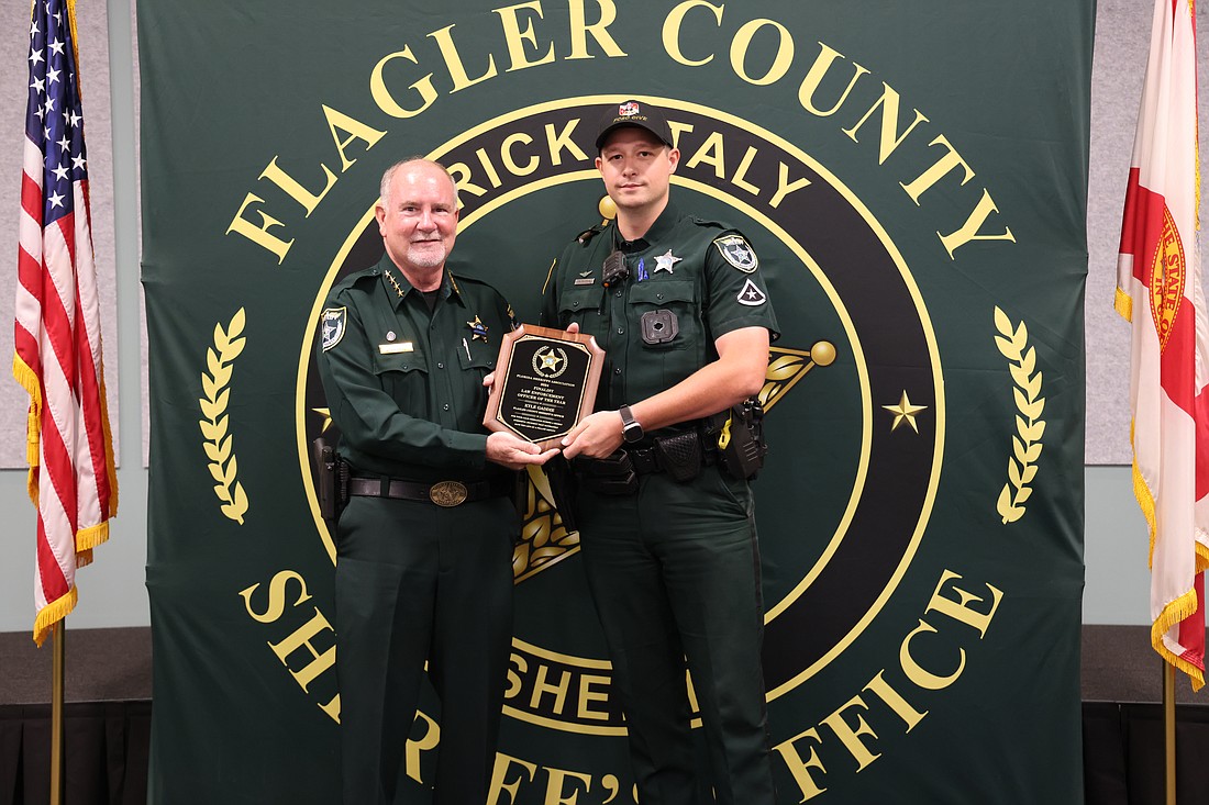 Sheriff Rick Staly presents Master Deputy Kyle Gaddie with a plaque for being a 2024 Law Enforcement Officer of the Year finalist. Courtesy photo