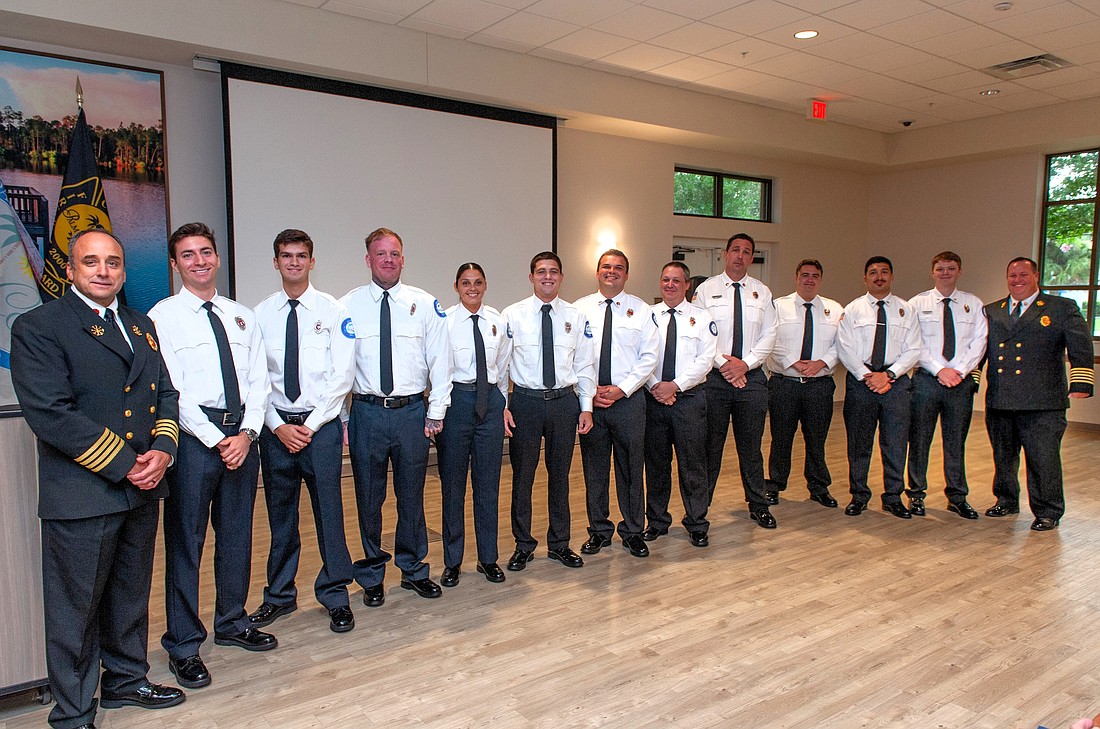 Newly promoted and recently hired Palm Coast firefighters with Deputy Fire Chief Bradd Clark (left) and Fire Chief Kyle Berryhill (right) at the Palm Coast Community Center. Courtesy photo