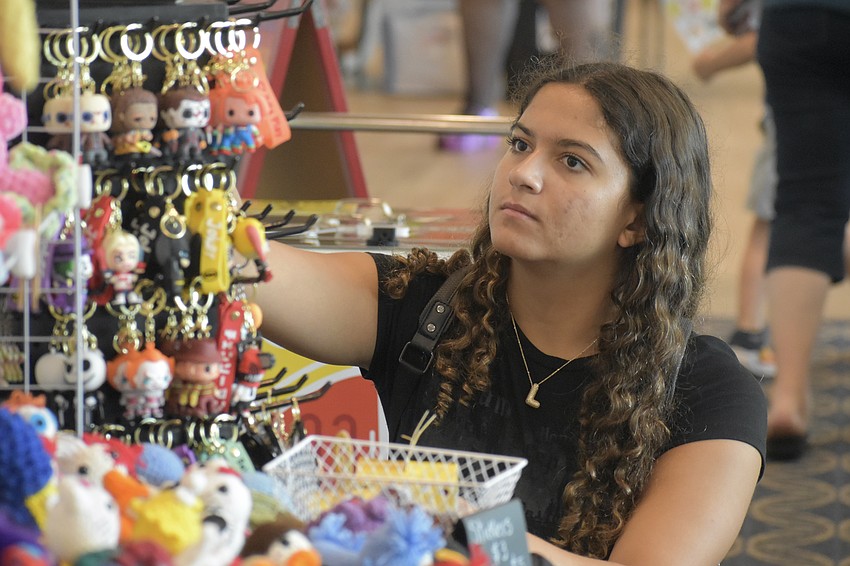 Luna Silva browses some keychains.