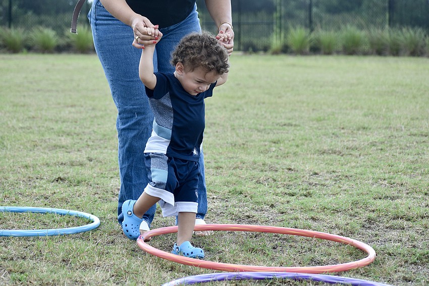 Levi Mandile is only 14 months old. He needs a little help through the course from mom Amanda Mandile.