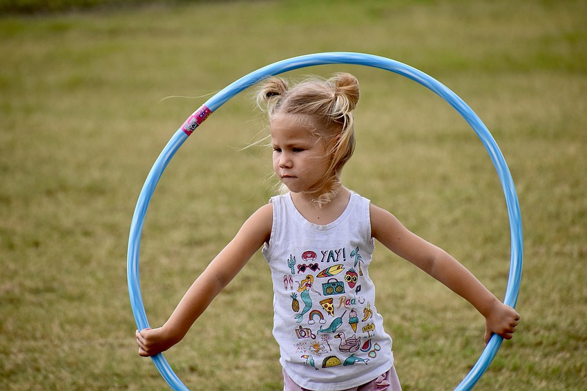 Myakka resident Ada Suggs, 2, contemplates what else can be done with a hula hoop.