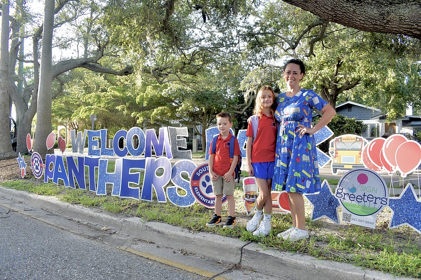 First grader Charlie Eicher and fifth grader Natalia Eicher with their mother Tina Eicher, a teacher at the school at Southside Elementary