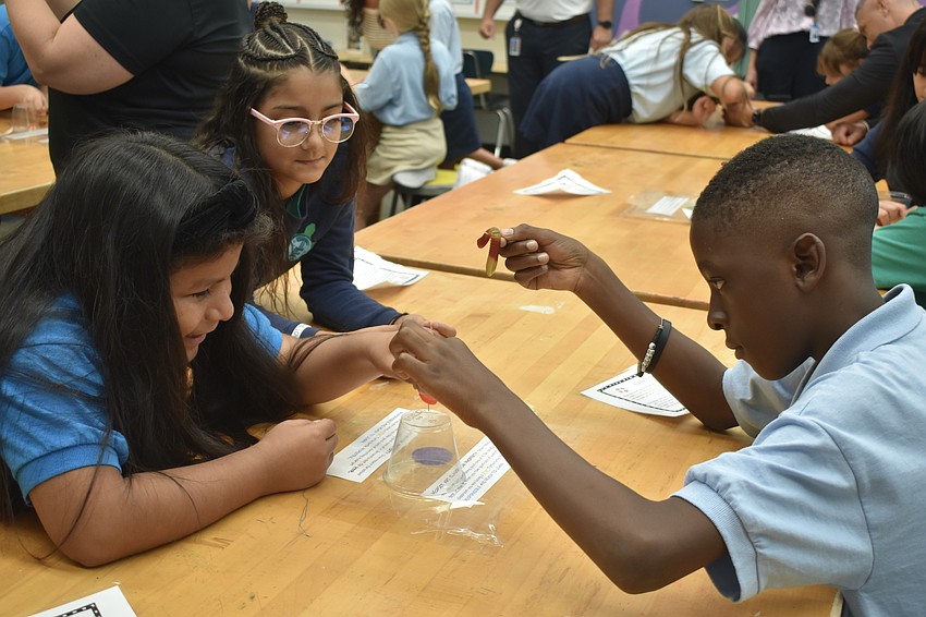 Aislinn Dominguez-Nino, Ava Alonso and Noah Moise perform a 