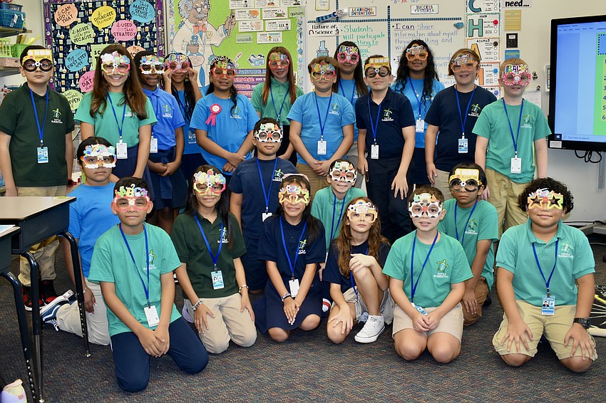 Students wear special back-to-school glasses in fifth grade teacher Justine Holcomb's class at Tuttle Elementary