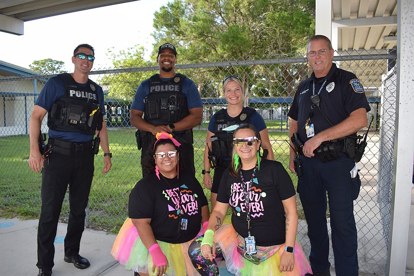 Officers Andrew Belzer, Daniel Stevens, Whitney Bentz, Mike Clarkson and teachers Maria Orduno and Heather Gomez.