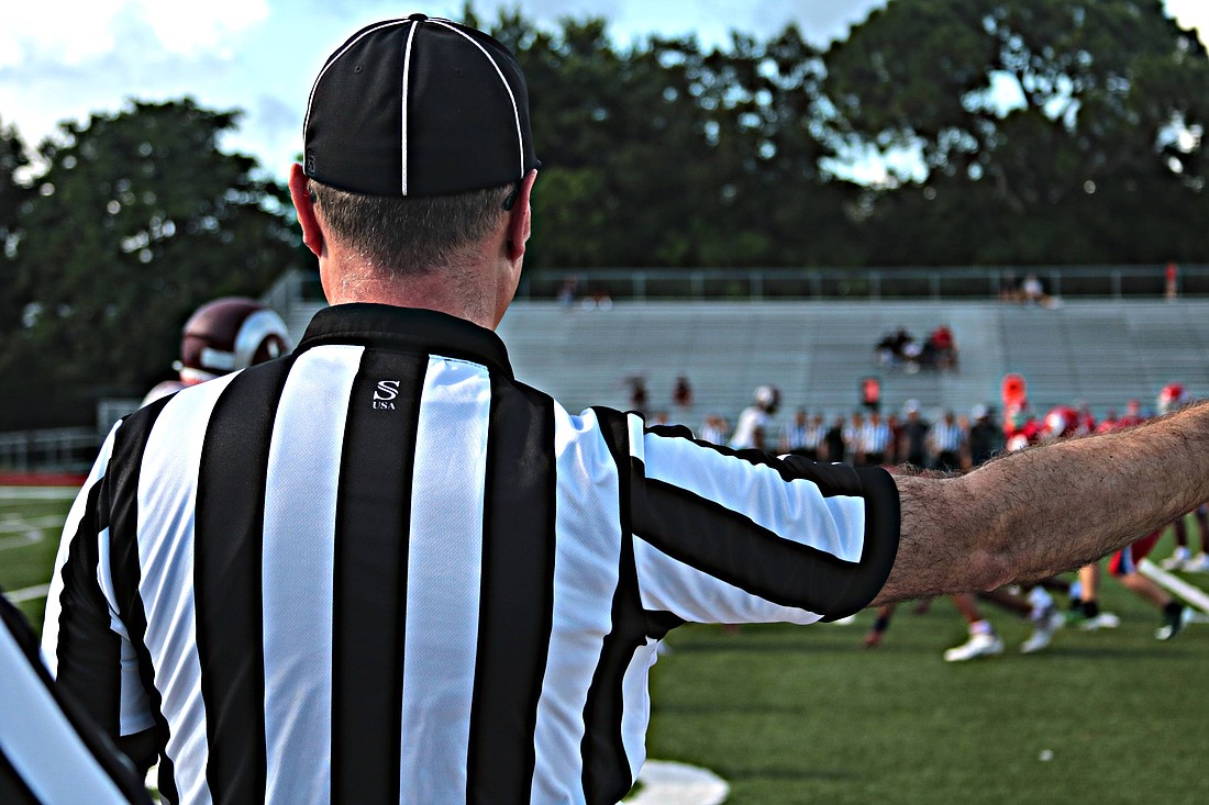 A lineman watches at the line of scrimmage as a play begins during a preseason scrimmage Aug. 10 at Riverview High School in Sarasota.