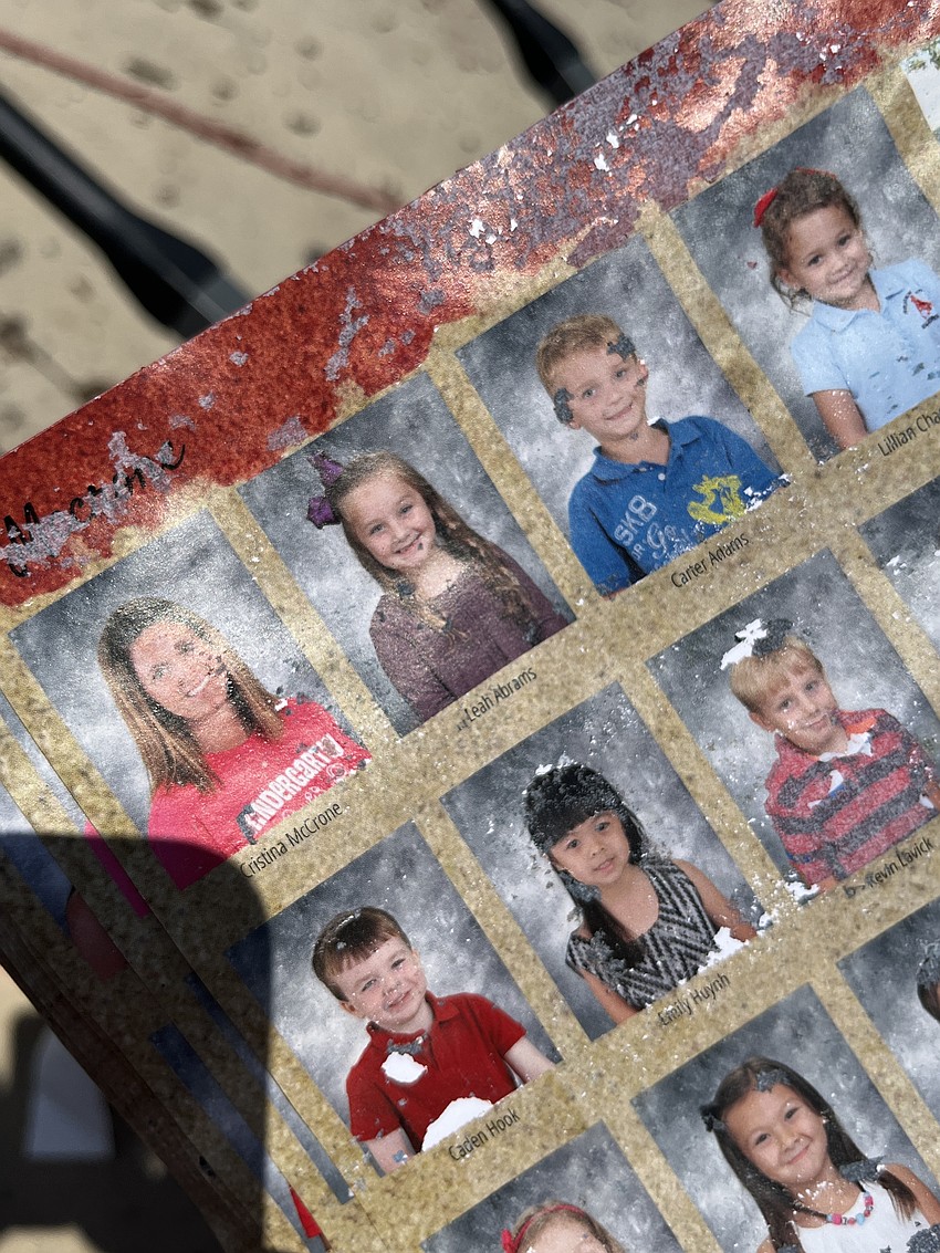 Summerfield Bluffs 13-year-old Leah Abrams is able to see her photo in her destroyed kindergarten yearbook.