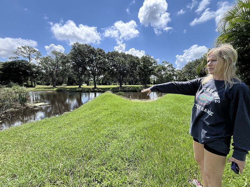 River Club's Nicole Eveloff explains that the Braden River behind her home was inundated and overflowed the two small ponds causing major flooding. 