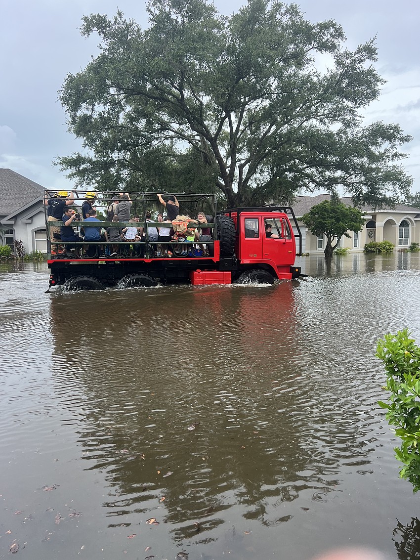Residents in Summerfield Bluffs are rescued after the Braden River flooded their street.