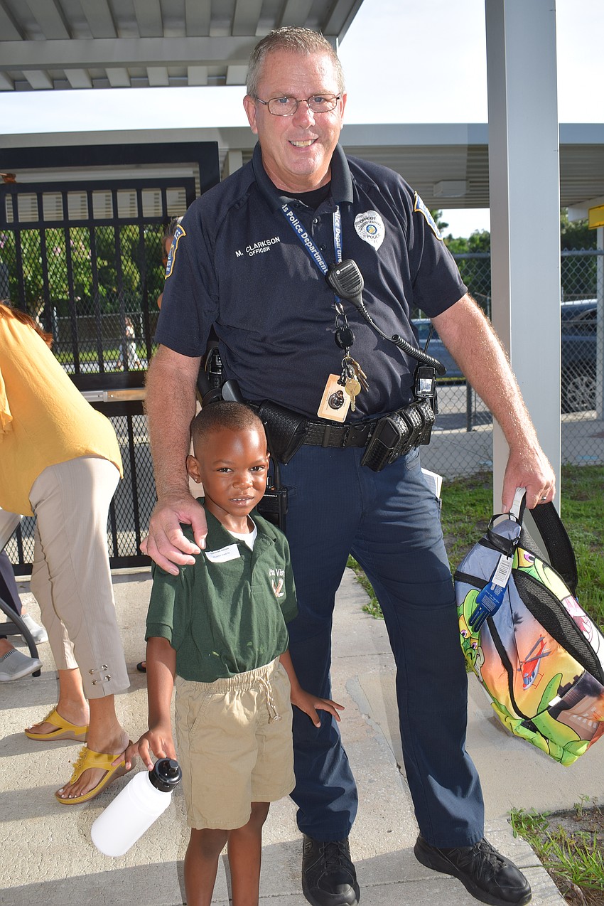 Grayson Coachman on his first day of kindergarten with Office Mike Clarkson