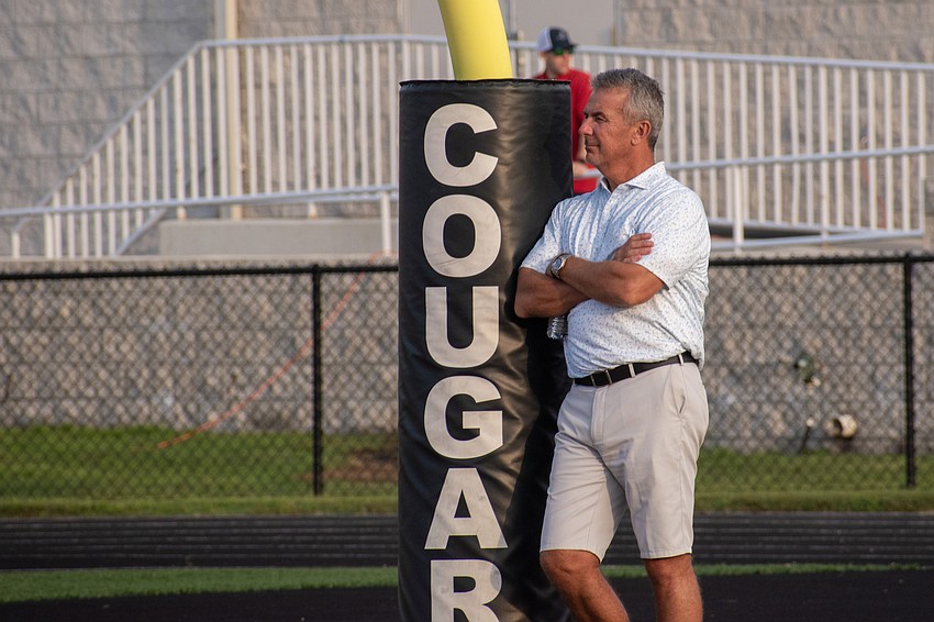 NCAA National Championship-winning coach Urban Meyer takes in the Cardinal Mooney High-Booker High preseason football game.