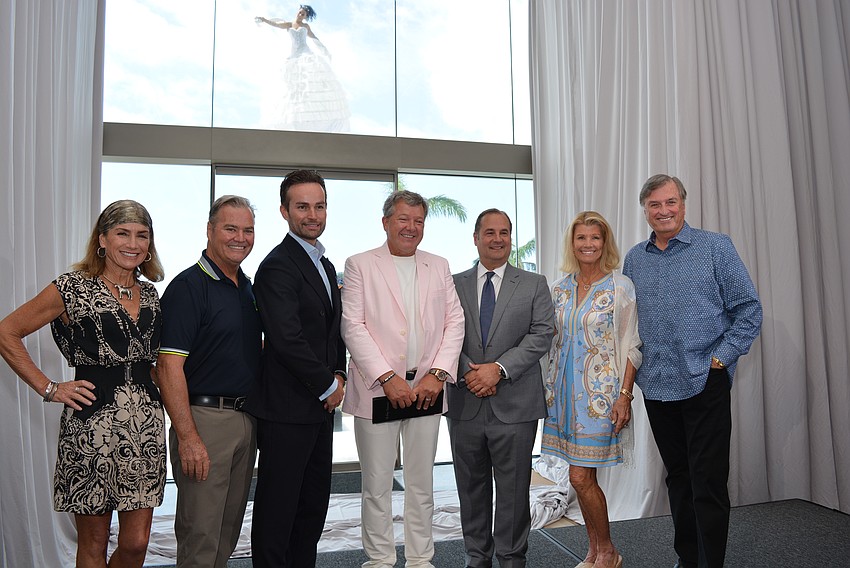 Jaymie and Tommy Klauber, Winfred van Workum, Chuck Whittall, Tony Capuano and Katie and Michael Moulton celebrate the Aug. 16 soft opening.