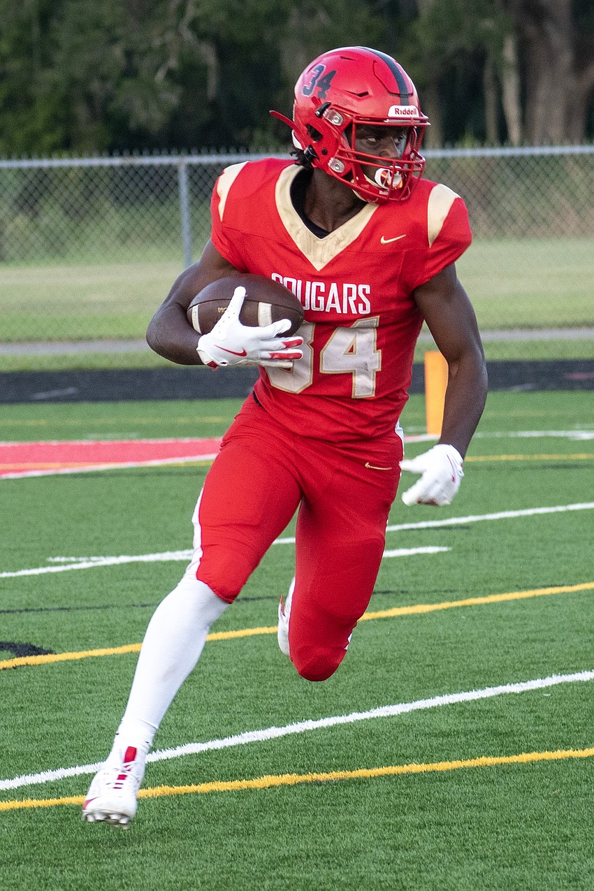 Cardinal Mooney High sophomore running back Connail Jackson showed off his physical running style against Booker High.