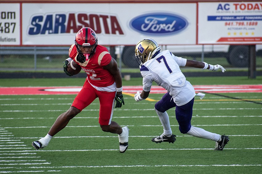 Cardinal Mooney's Kymistrii Young jukes out Booker's Abraham Brown III.