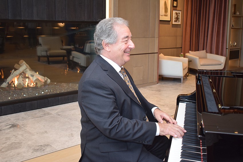 Joe Micals playing piano in the resort's main lobby.