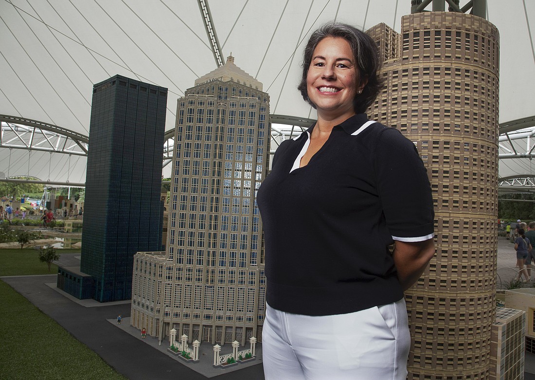 Legoland President Franceen Gonzales at the park's Lego-built version of downtown Tampa.